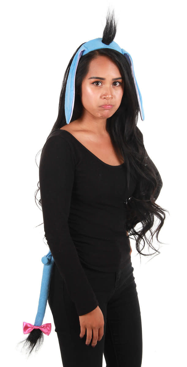 A woman wearing an Eeyore ears, headband, and tail kit costume from Winnie the Pooh.