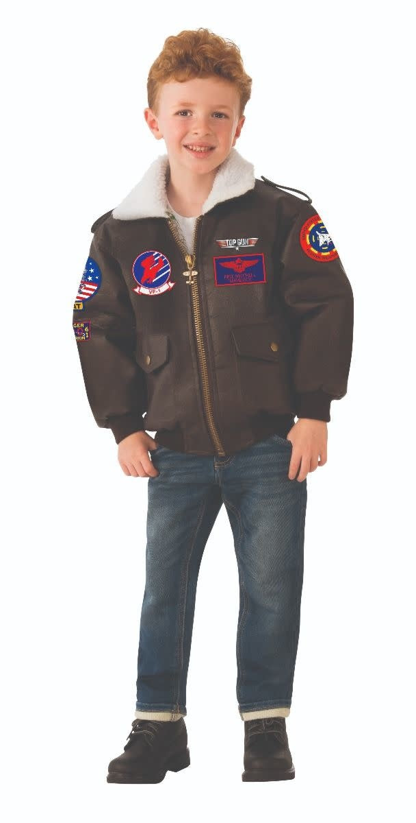 A kid standing to the side wearing a kids Top Gun Bomber Jacket.