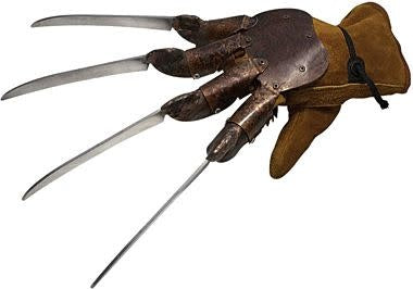 A freddy Krueger leather glove costum with pointy knives at the end.