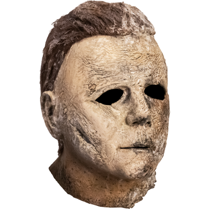 A Latex Michael Myers Mask from the movie Halloween Ends where part of the face is burnt.