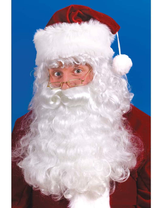A man dressed as Santa Claus wearing a Santa wig and beard set.