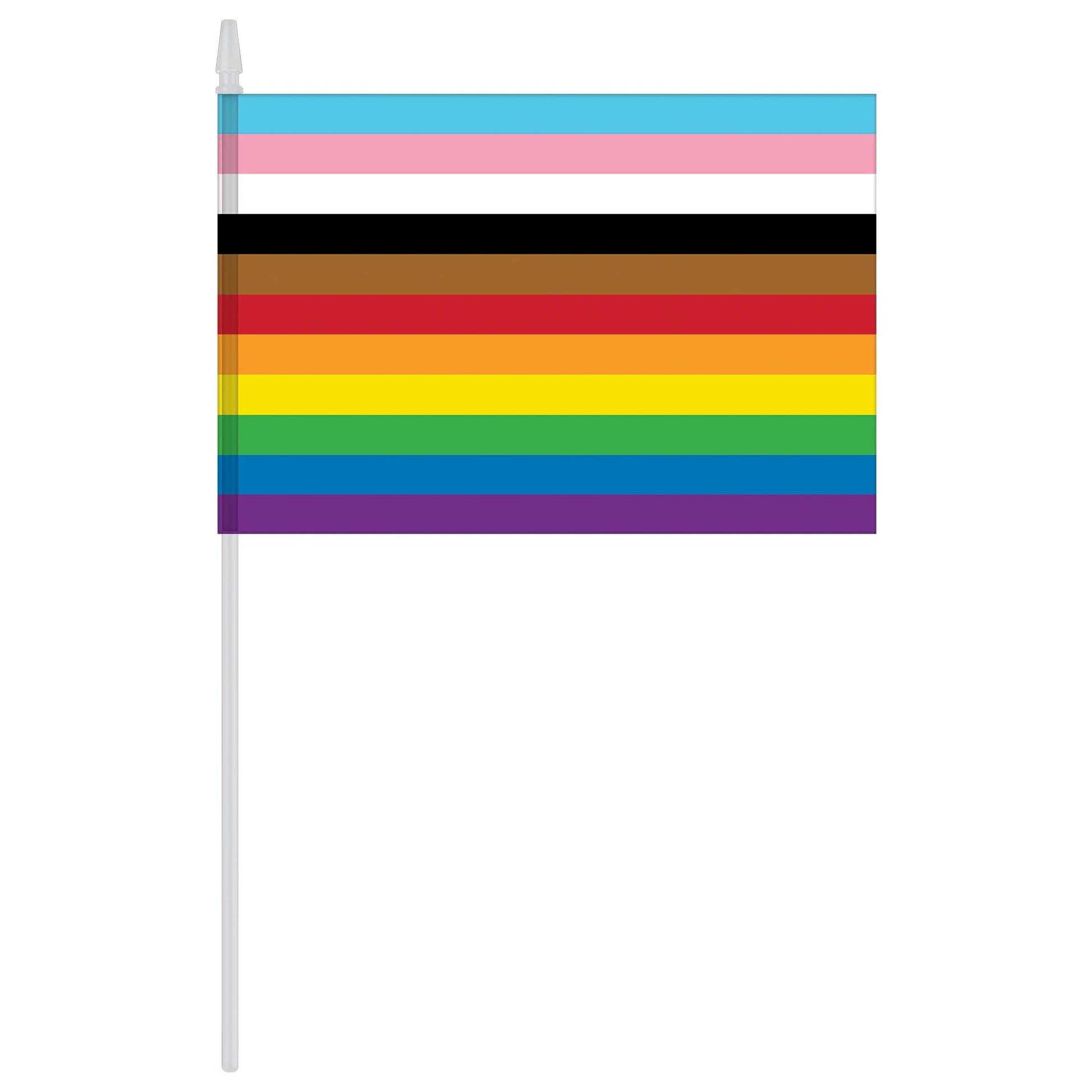 A handheld inclusive rainbow pride flag. 