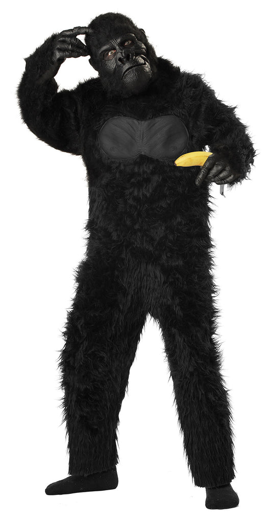 A kid wearing a kids gorilla costume with a banana.