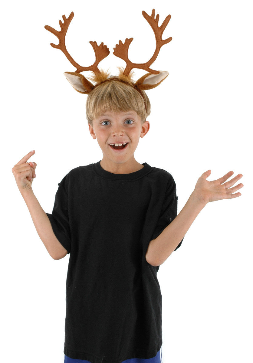 A kid wearing a reindeer ears & antlers headband. 