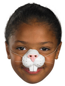 A child wearing an elastic bunny nose for a costume.