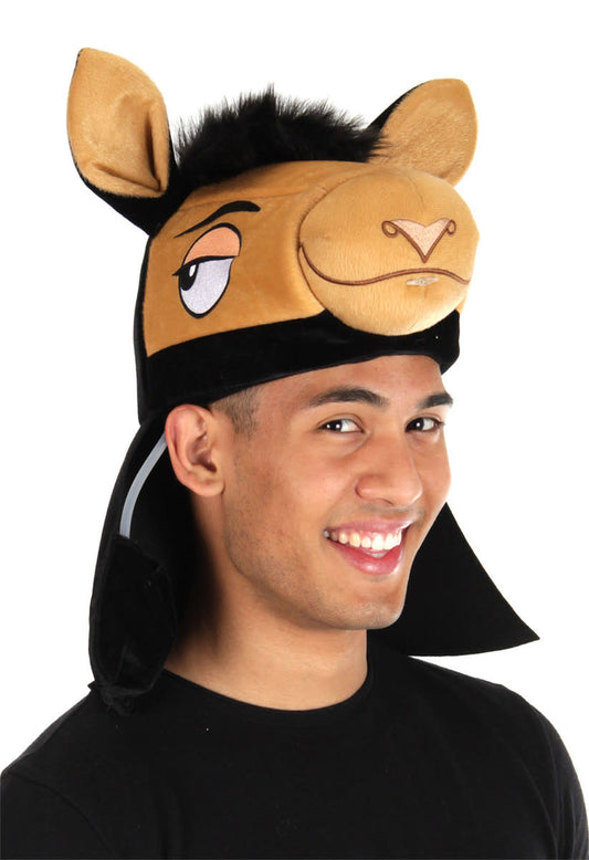 A guy wearing a Kuzco toy hat.