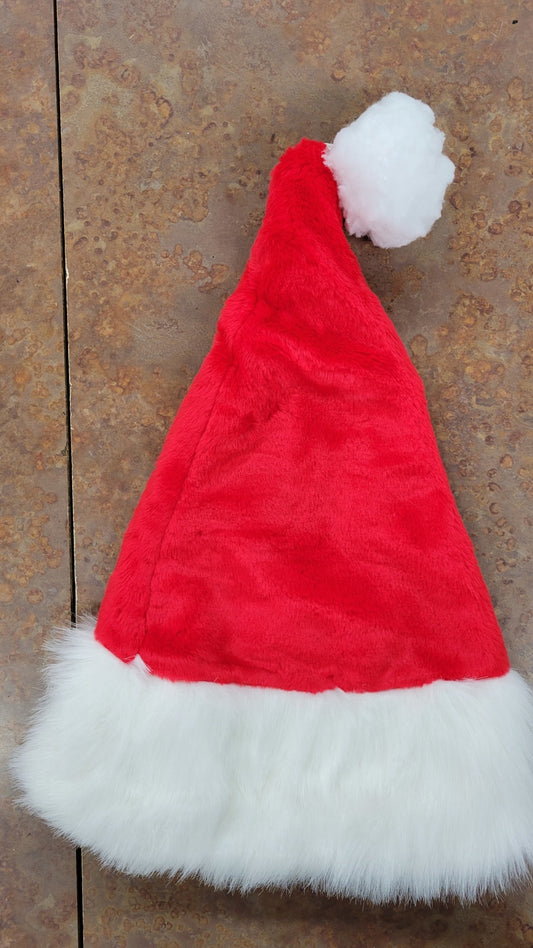 A close up of a satin lined Santa Hat.
