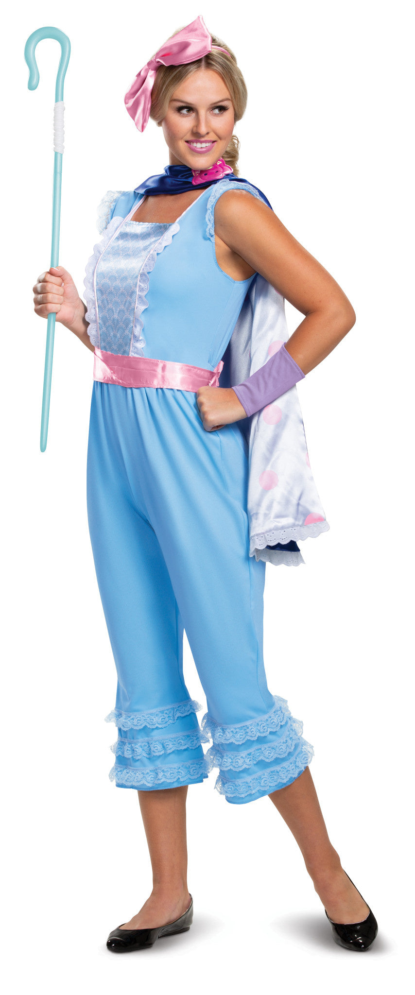 A woman posing with her cane while wearing the adult deluxe bo peep costume from Toy Story.