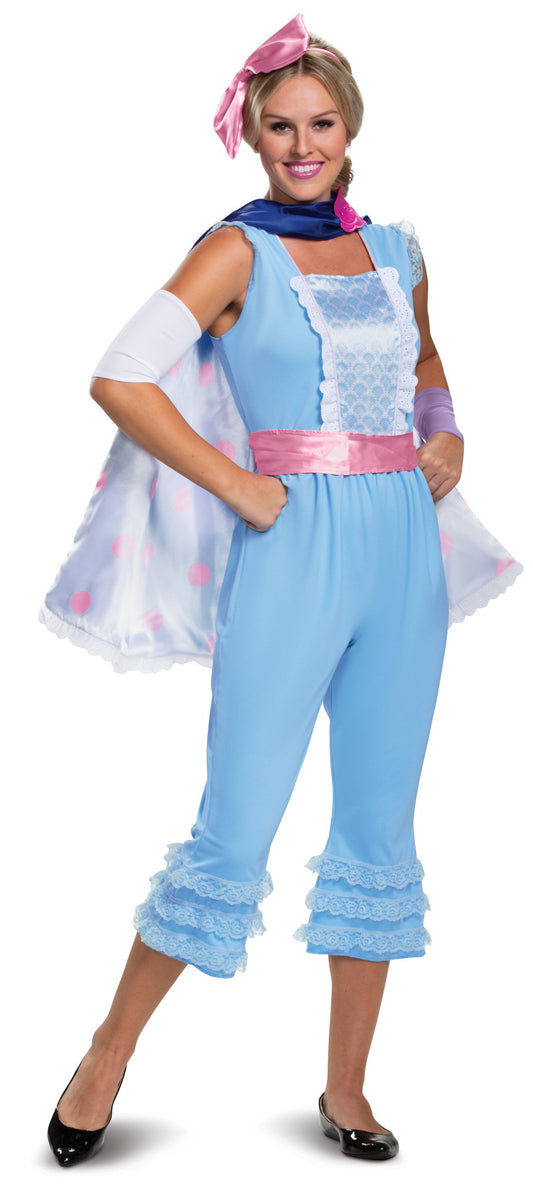 A woman wearing a deluxe Bo Peep Costume with her arms on her hips.