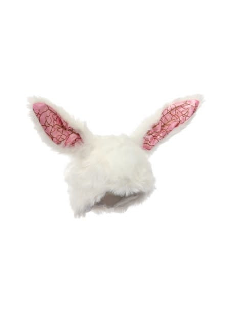 A close up of a plush rabbit ears hat.