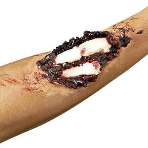 A close up of the compound fracture prosthetic makeup kit giving the illusion of an arm with a compound fracture.