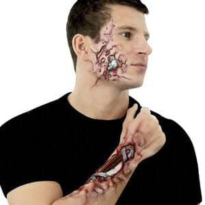 A man with makeup prosthetics to show he is also a robot in human skin.