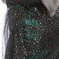 A close up of the back waist of a wicked witch costume plus size.