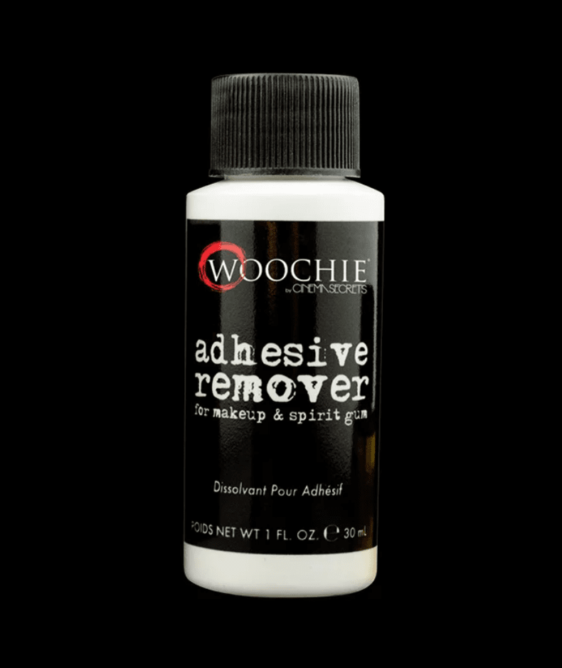 A bottle of Woochie adhesive remover for makeup and spirit gum.