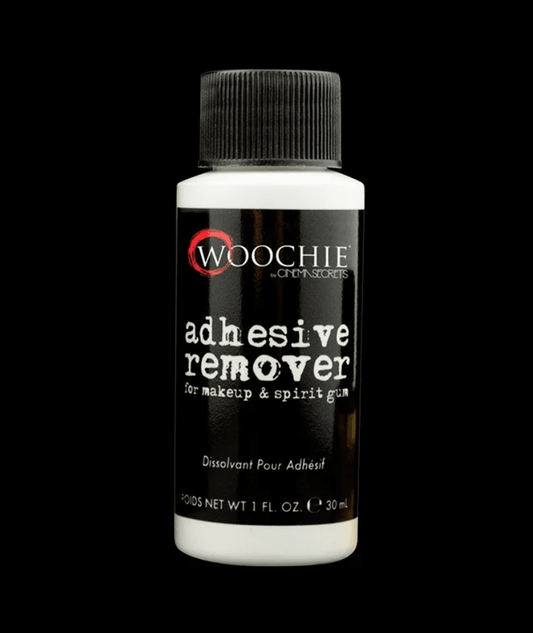 A bottle of Woochie adhesive remover for makeup and spirit gum.