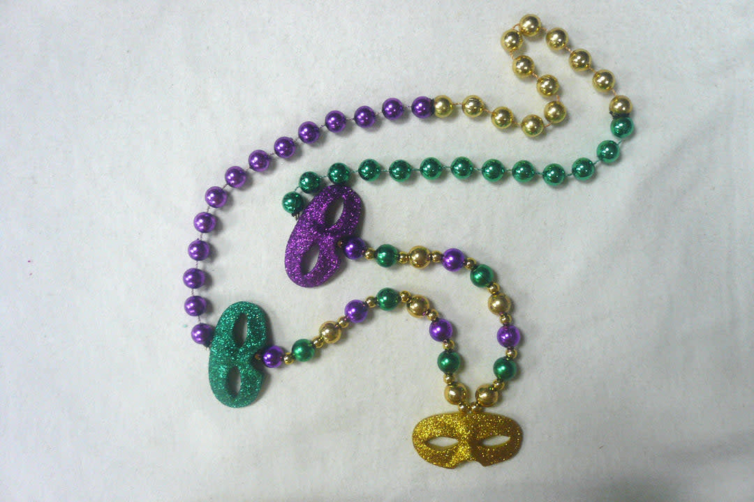 A look at the Mardi Gras three color glittered mask beads. 