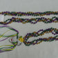 A view of specialty Mardi Gras masquerade mask beads.