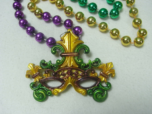 Specialty Mardi Gras beads with a Venetian Mask at the end. 
