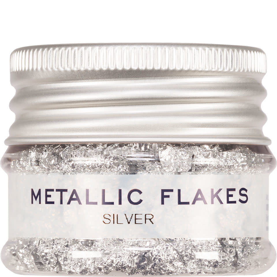 A jar of silver metallic flakes.