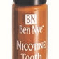 A bottle of Ben Nye tooth color makeup in the nicotine color.