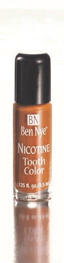 A bottle of Ben Nye tooth color makeup in the nicotine color.